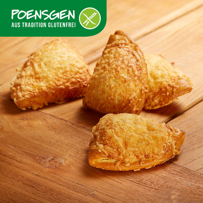 Käse-Schinken-Taschen glutenfrei 4x90g - Poensgen

Unsere glutenfreien Käse‑Schinken‑Taschen kombinieren knusprigen Teig mit herzhaftem Schinken und geschmolzenem Gouda – ein köstlicher Snack, der Komfort und Genuss in jedem Biss vereint. Ob als unkomplizierte Mahlzeit, deftige Zwischenmahlzeit oder herzhafter Begleiter zu Salaten – perfekt, wenn man sich bewussten, aber trotzdem vollen Geschmack wünscht.