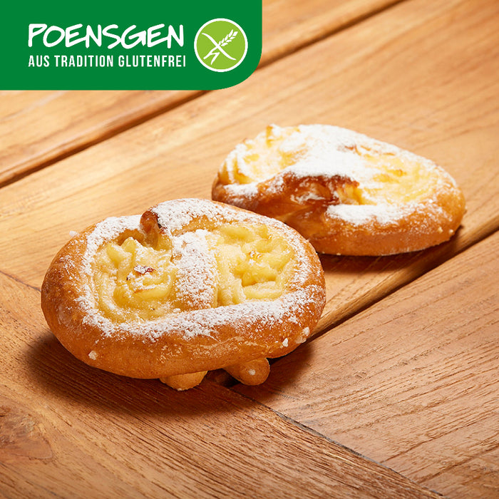 Puddingbrezeln glutenfrei 2x110g - Poensgen

Unsere Puddingbrezeln verbinden zarten Hefeteig mit einer cremigen Puddingfüllung und einem Hauch Puderzucker. Ideal für alle, die auf Gluten verzichten möchten, aber nicht auf Geschmack. Perfekt für den Kaffee, zum Frühstück oder einfach als süßer Snack zwischendurch – für einen genussvollen Moment ganz ohne Kompromisse.